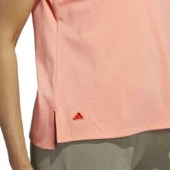 Adidas 2023 Women's Go-To Heathered Polo 12 Adidas 2023 Women's Go-To Heathered Polo -Golf Equipment Shop adidas 23 womens go to heathered polo coral fusion detail2 itempicture