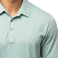 TravisMathew The Zinna Polo -Golf Equipment Shop travismathew 2023 the zinna polo heather bearl green logo itempicture